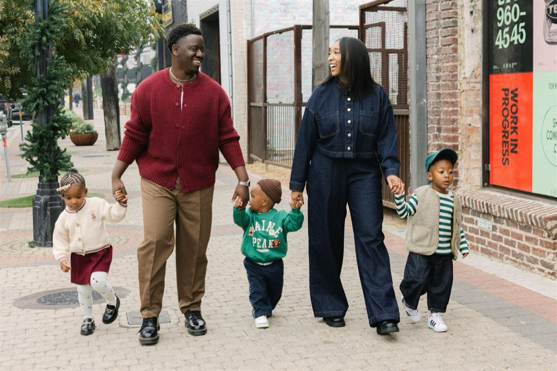 Nigel walking with his wife and three children