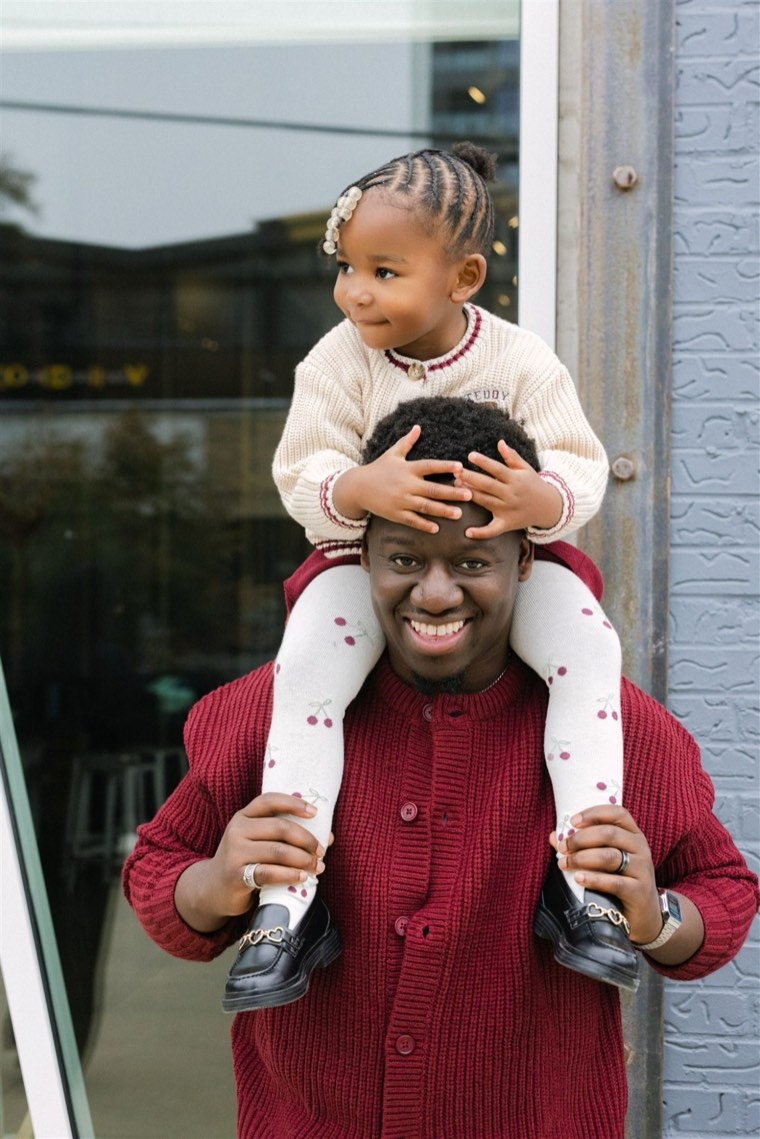 Nigel with his daughter on his shoulders